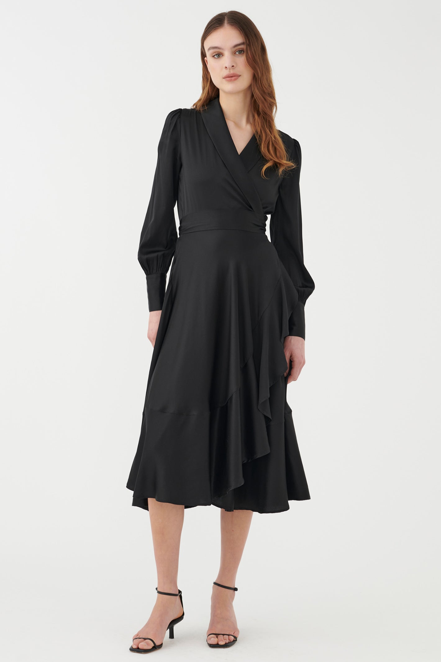 Woman wearing a black dress on a white background