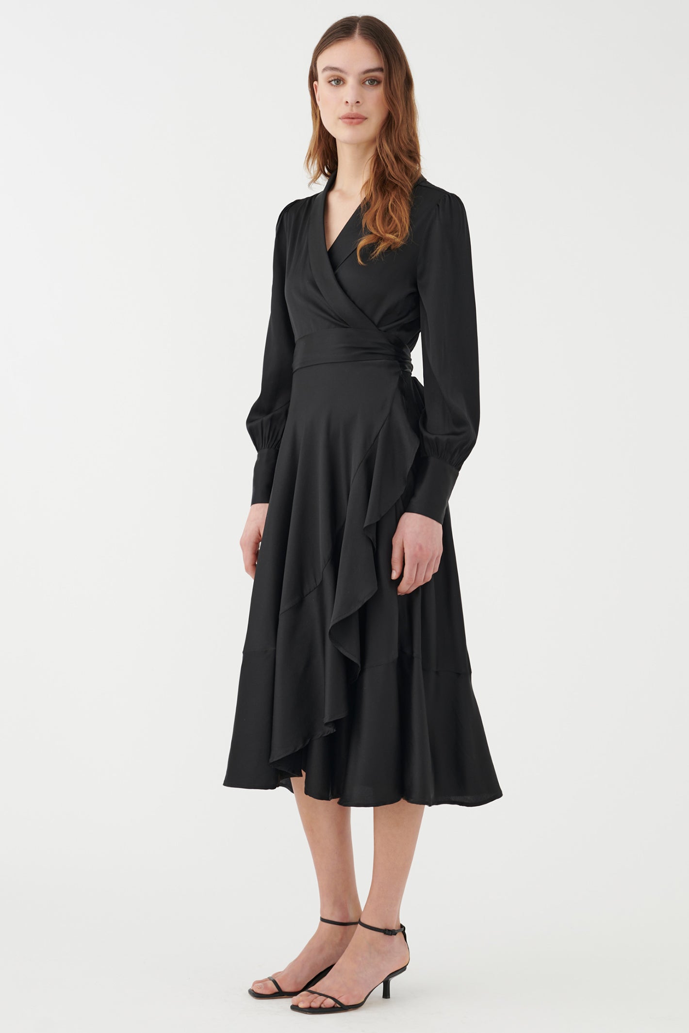 Woman wearing a black dress on a white background