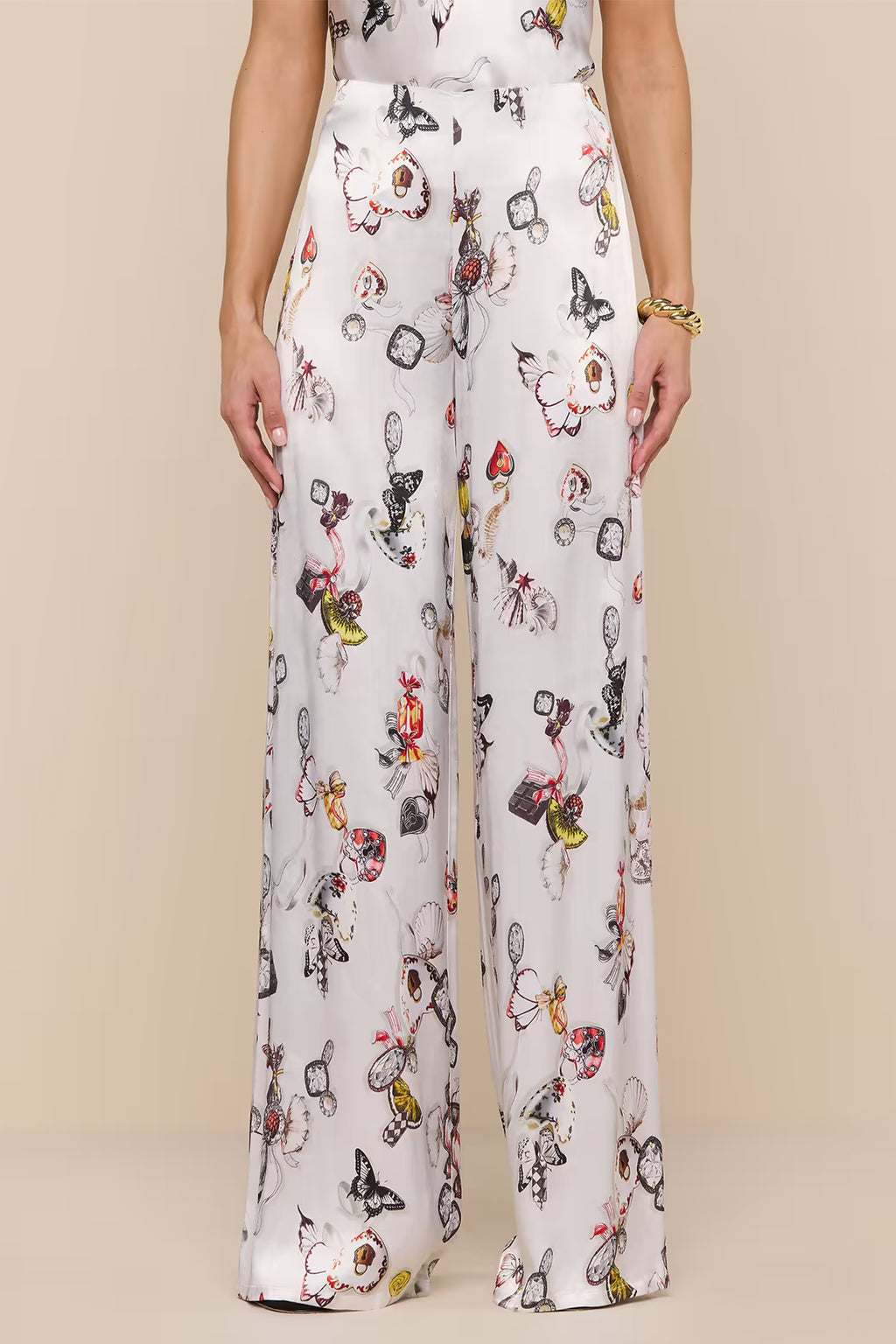 L'Agence Kimia ecru satin trousers, multi-colour lock butterfly motif
