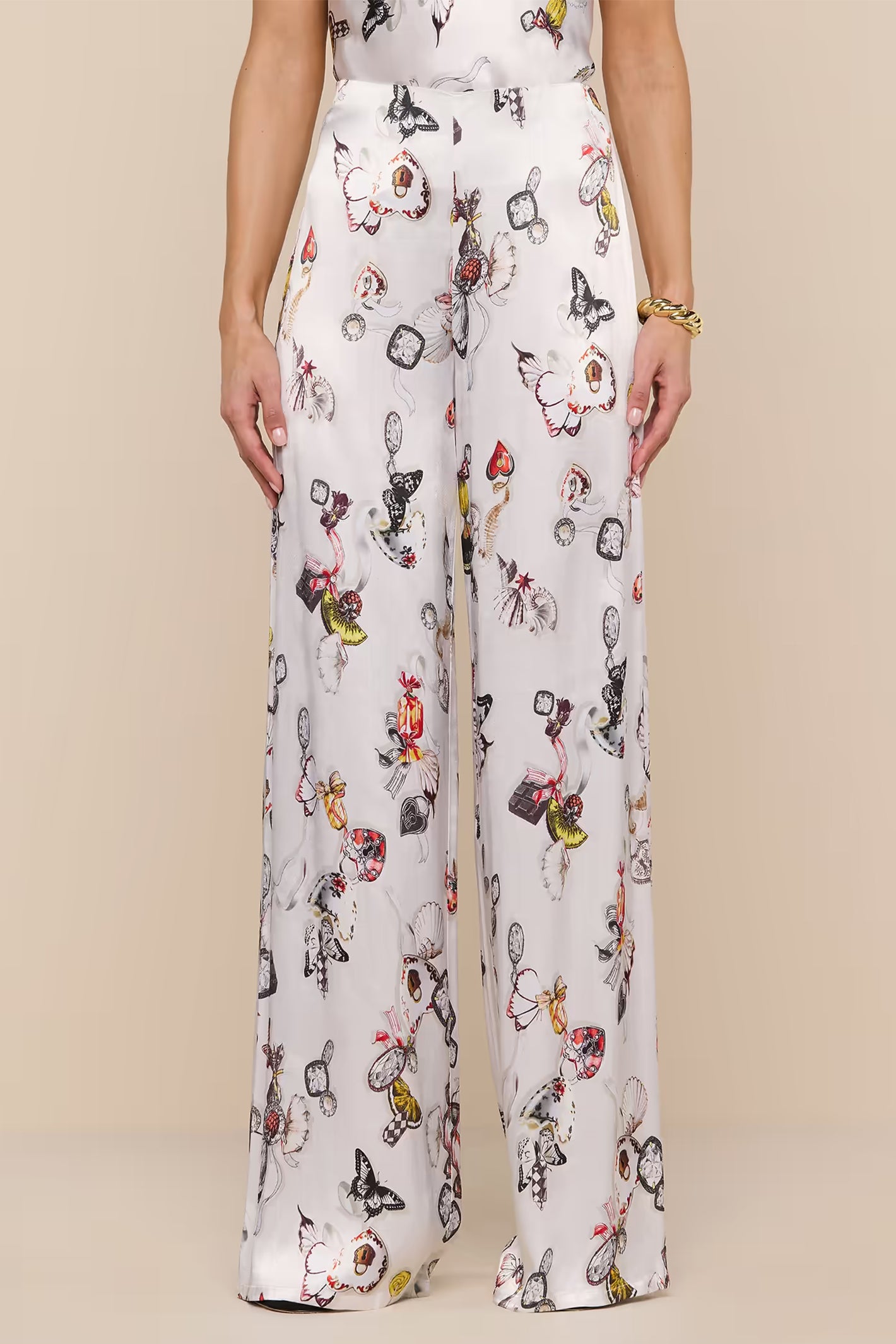L'Agence Kimia ecru satin trousers, multi-colour lock butterfly motif