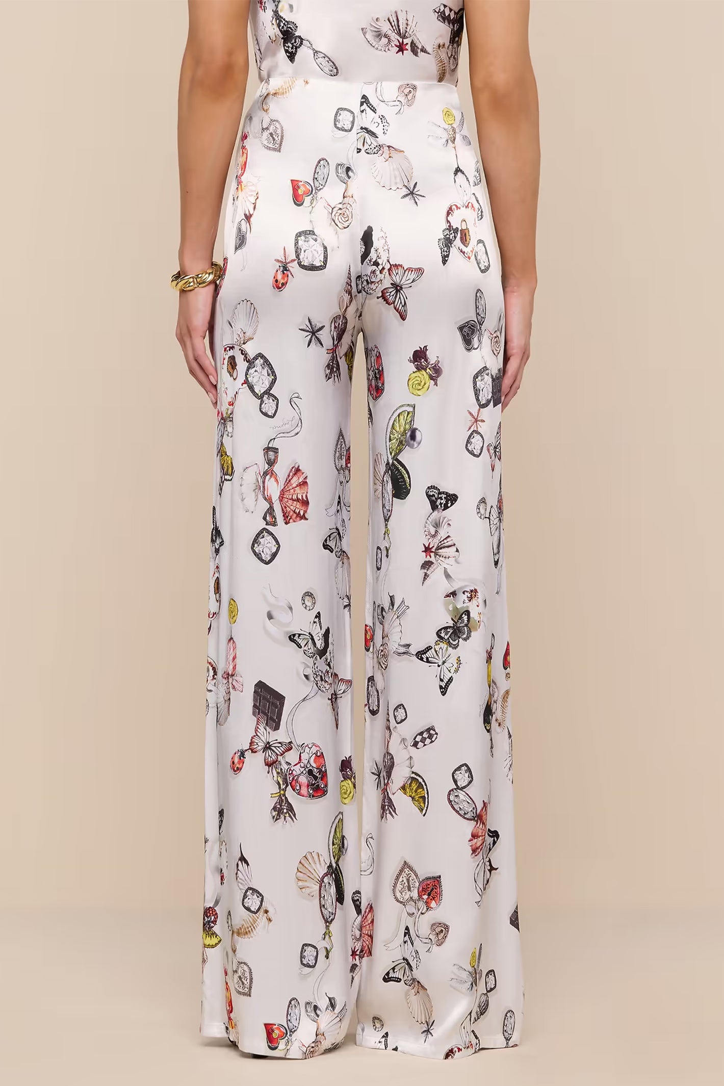 L'Agence Kimia ecru satin trousers, styled with matching camisole