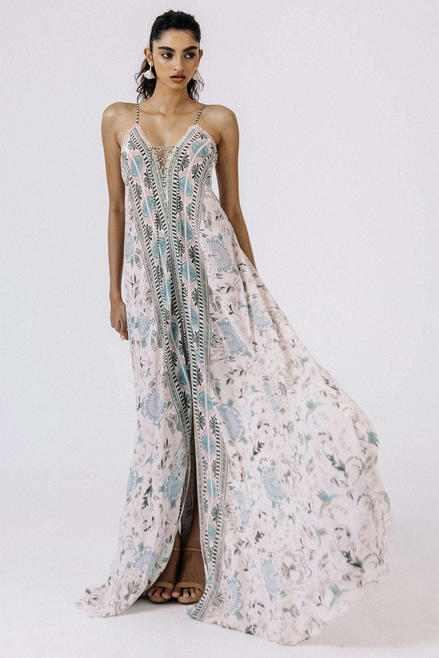 Woman wearing a floral dress on a white background