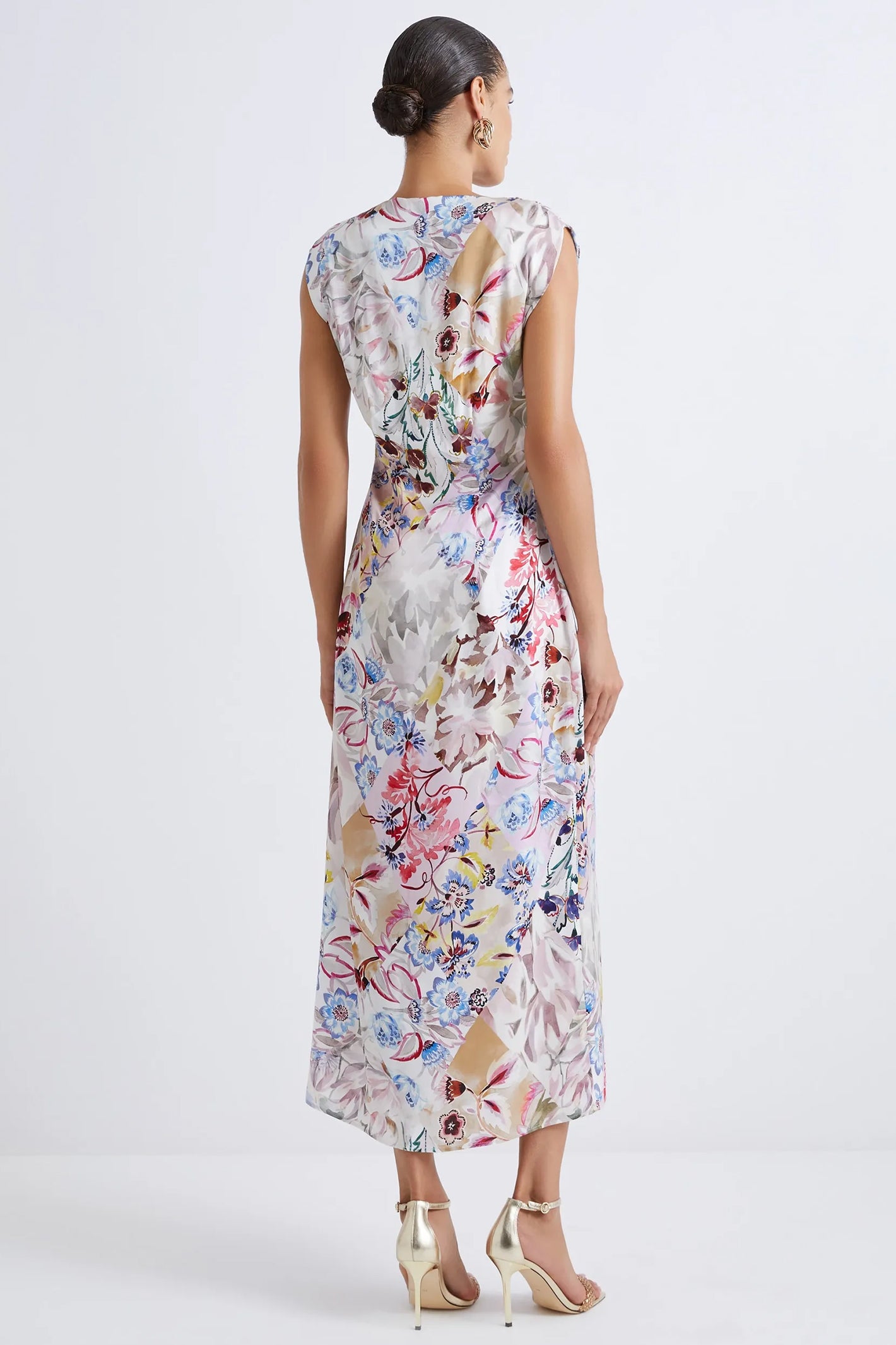 Woman wearing a floral dress on a white background