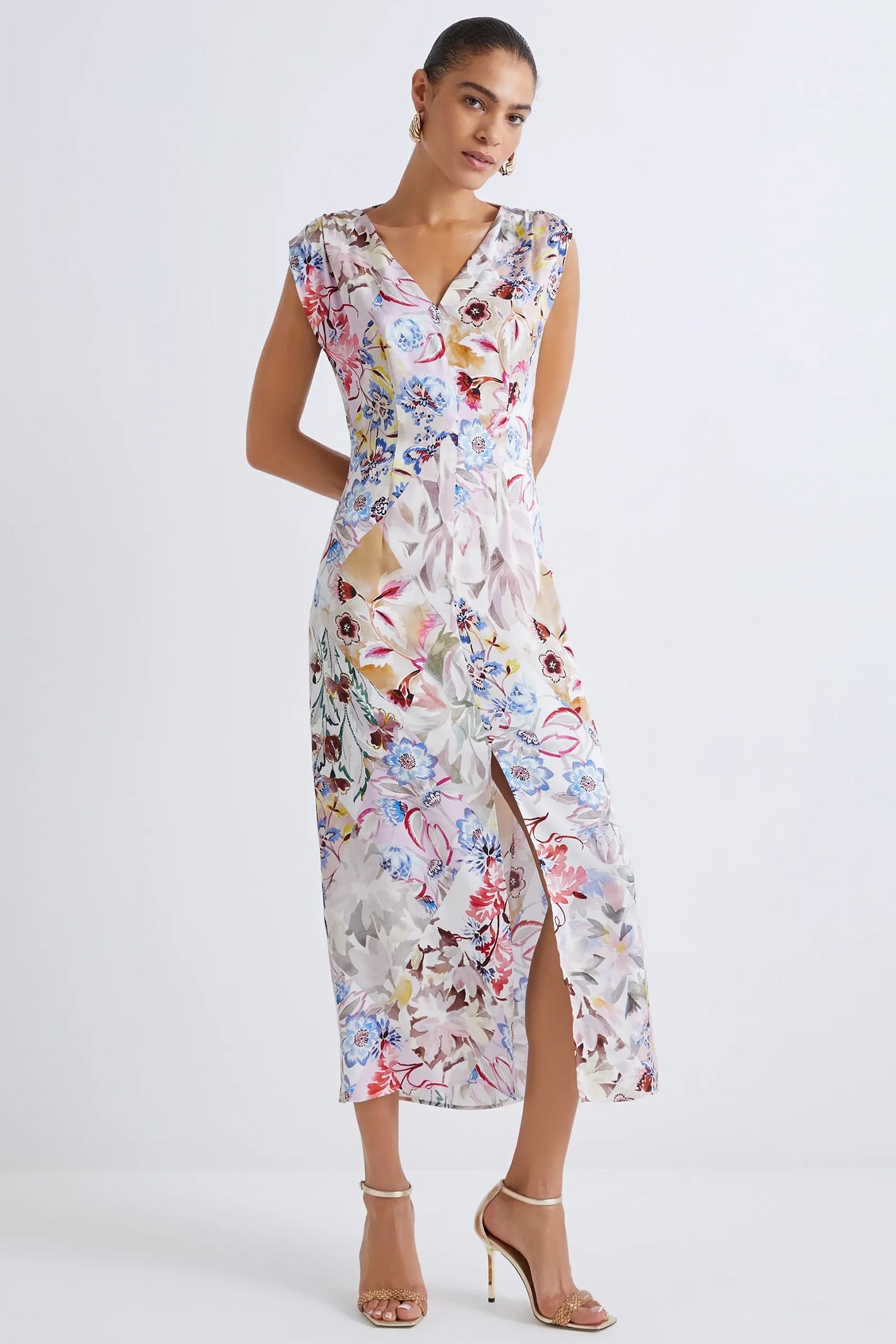 Woman wearing a floral dress on a white background