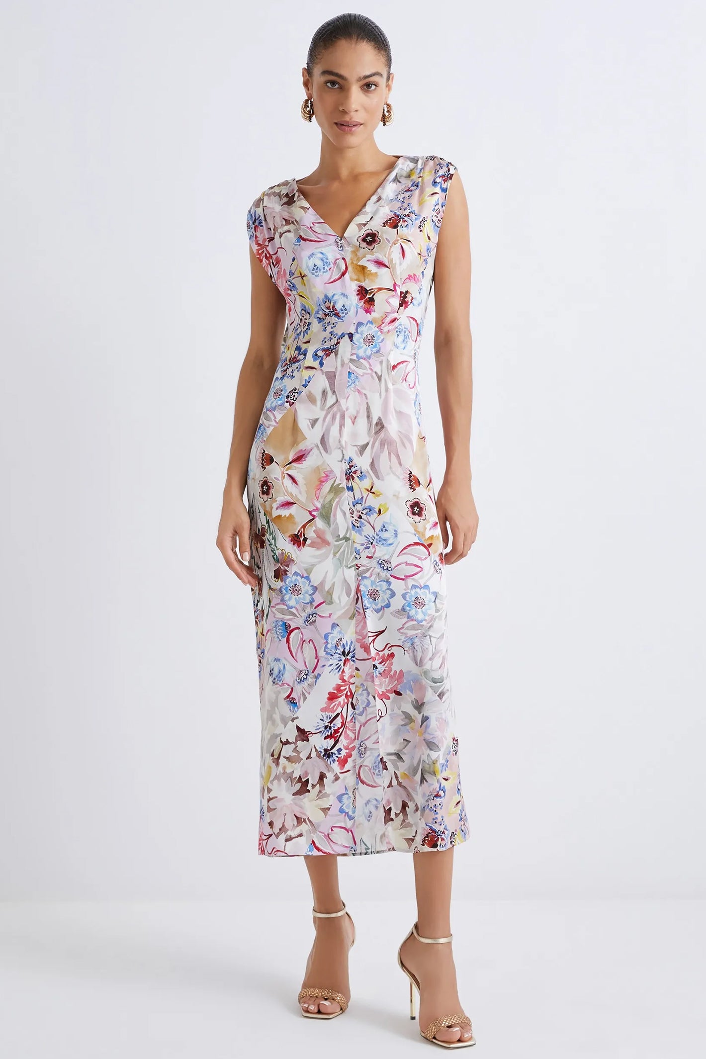 Woman wearing a floral dress on a white background
