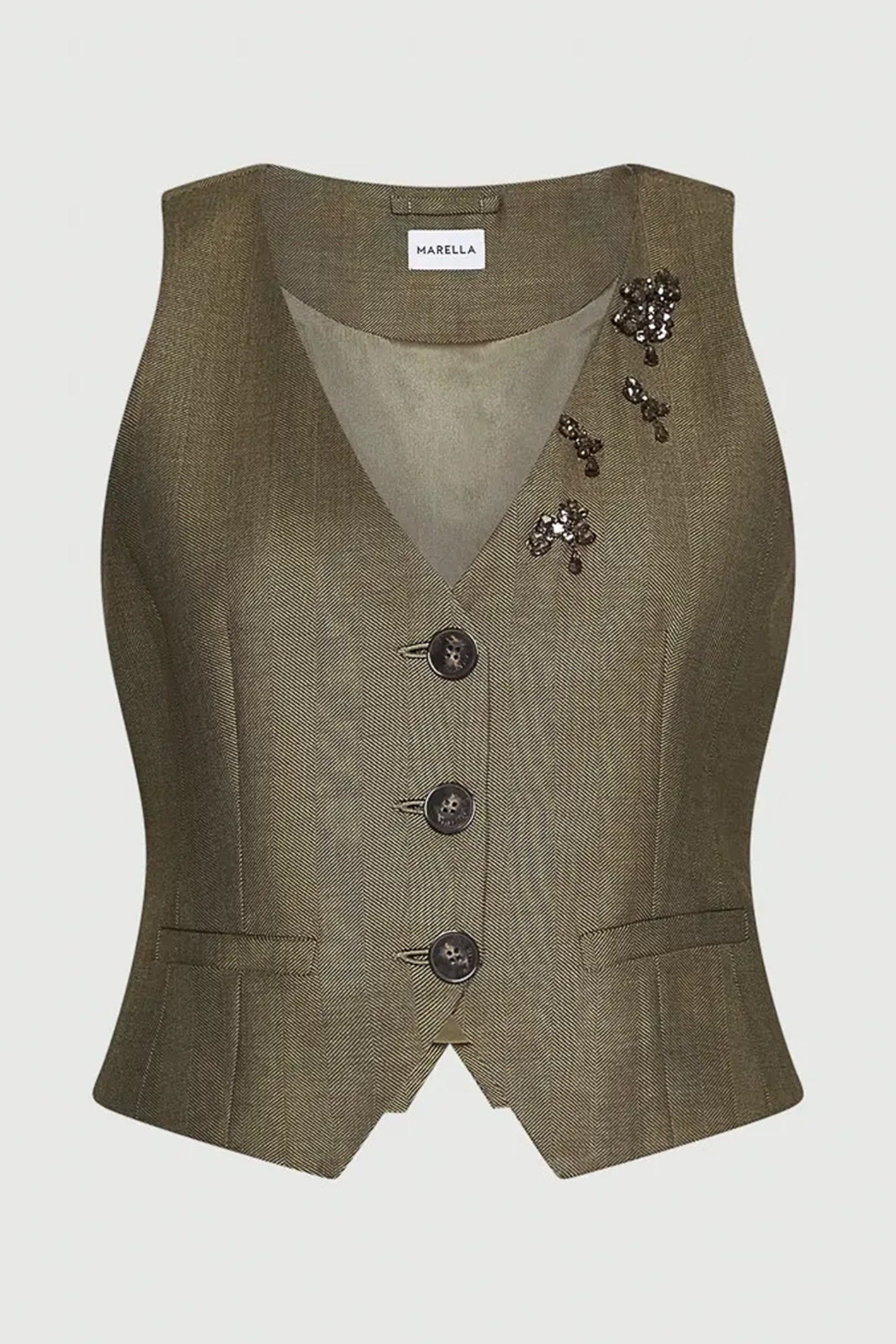 Green vest with decorative buttons on a light gray background