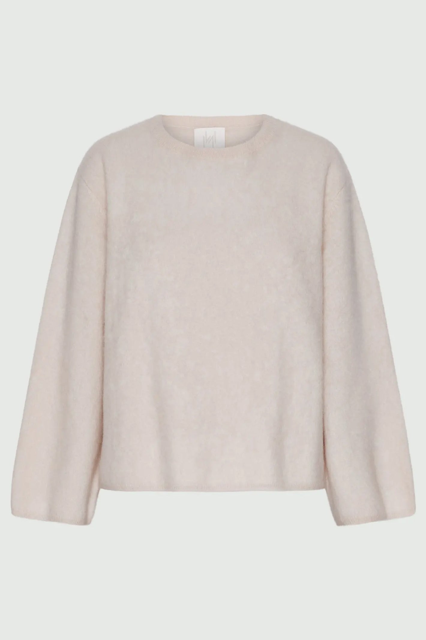 Beige sweater on a light gray background