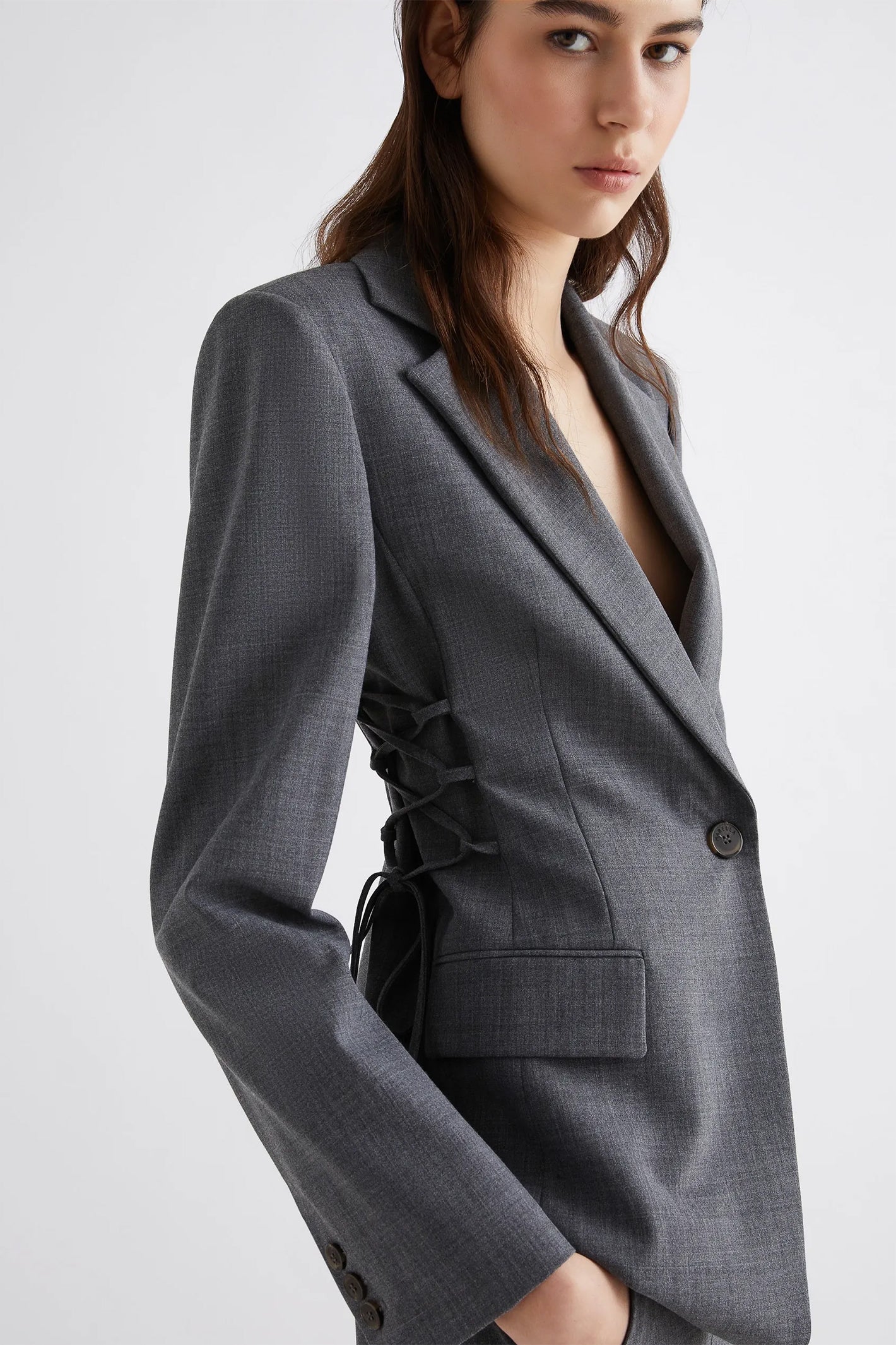 Gray suit jacket with a plain background