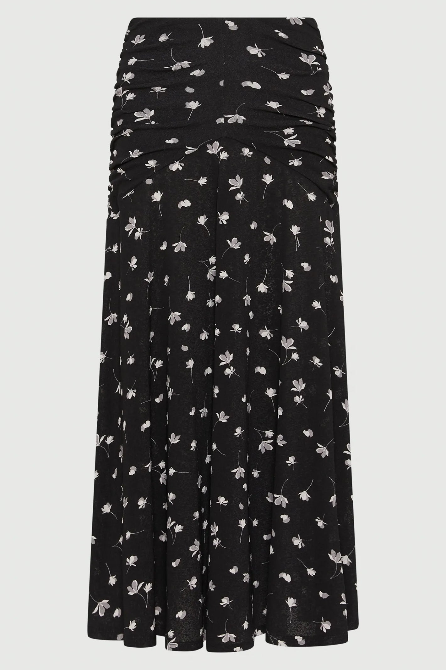 Black skirt with white floral pattern on a white background